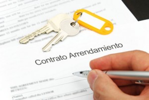 rental agreement form with signing hand and keys and pen